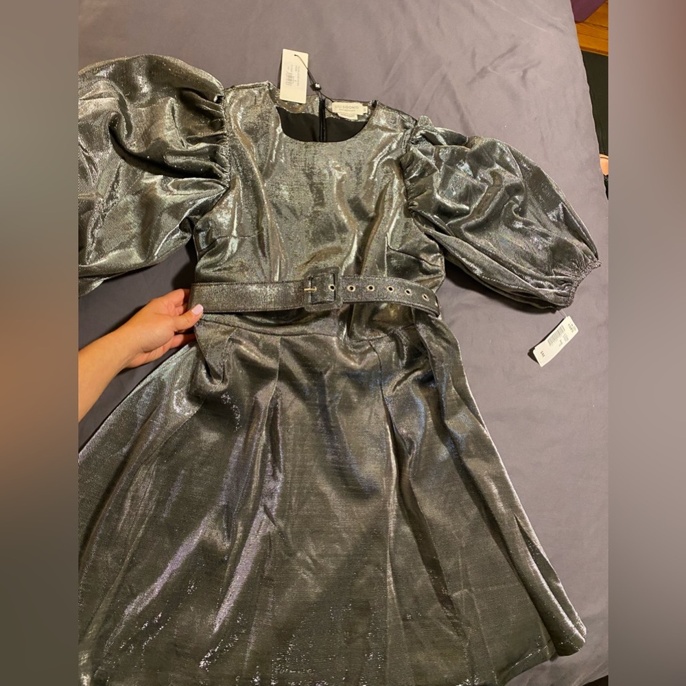 Never worn. Gun metal, woven metallic minidress. Puffed sleeves. Cinched waist.